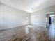 Open living room with hardwood flooring, and natural light coming through the windows at 2528 Double Tree Pl, Oviedo, FL 32766