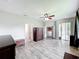 Spacious living room featuring hardwood floors, ceiling fan and multiple doorways at 2528 Double Tree Pl, Oviedo, FL 32766