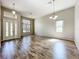 Bright living room features hardwood floors, high ceilings, and lots of natural light at 2528 Double Tree Pl, Oviedo, FL 32766