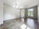 Bright, expansive living room featuring wood floors, and large windows at 2528 Double Tree Pl, Oviedo, FL 32766