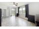 Bright main bedroom with light wood floors, ceiling fan, large windows and sliding glass doors at 2528 Double Tree Pl, Oviedo, FL 32766