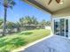Relaxing covered patio overlooking the lush, fenced backyard, perfect for entertaining or unwinding at 2528 Double Tree Pl, Oviedo, FL 32766