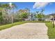 Enjoy a game of volleyball at the community sand court, perfect for active outdoor fun in a lush green setting at 2528 Double Tree Pl, Oviedo, FL 32766