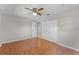 Bedroom with wood floors, a ceiling fan and dual windows offering natural light at 2666 Derbyshire Rd, Maitland, FL 32751