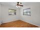 Bedroom with wood floors, neutral paint and dual windows offering natural light at 2666 Derbyshire Rd, Maitland, FL 32751