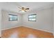 Bedroom with wood floors, a ceiling fan and dual windows offering natural light at 2666 Derbyshire Rd, Maitland, FL 32751