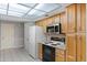 Kitchen with stainless steel appliances and a skylight at 2666 Derbyshire Rd, Maitland, FL 32751
