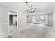 Open living room flows into the kitchen and dining area with ample natural light at 2666 Derbyshire Rd, Maitland, FL 32751
