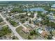 Aerial view of a neighborhood featuring houses, a pond, and lots of green trees at 2880 Trenton Ln, Deltona, FL 32738