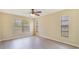 Bright bedroom with natural light, wood floors, and neutral walls at 2880 Trenton Ln, Deltona, FL 32738