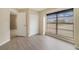 Cozy bedroom with a closet and a large window providing ample natural light, and laminate flooring at 2880 Trenton Ln, Deltona, FL 32738