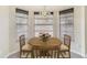 Charming breakfast nook area with a bright bay window and a wooden table with four chairs at 2880 Trenton Ln, Deltona, FL 32738
