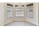 Cozy dining nook featuring a bay window with blinds and a decorative light fixture at 2880 Trenton Ln, Deltona, FL 32738