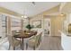 Inviting dining room featuring a bay window, modern chandelier and space for seating six at 2880 Trenton Ln, Deltona, FL 32738