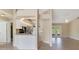 Modern kitchen area with stainless steel appliances and adjacent to a living area with French doors at 2880 Trenton Ln, Deltona, FL 32738