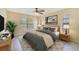 Comfortable main bedroom featuring a ceiling fan, neutral decor, and ample natural light at 2880 Trenton Ln, Deltona, FL 32738