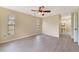 Spacious main bedroom featuring wood floors, neutral walls, and an attached bathroom at 2880 Trenton Ln, Deltona, FL 32738