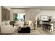 Inviting living room with a comfortable sectional sofa and stylish decor at 2883 Transformation Way, Clermont, FL 34714