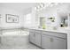 Bright bathroom with double vanity, large mirror, soaking tub, and tile accents at 3009 Namaste Dr, Clermont, FL 34714
