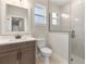 Modern bathroom design with a sleek vanity, walk-in shower with glass door, and contemporary fixtures at 3022 Peel Ave, Orlando, FL 32806