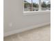 Comfortable bedroom features a light-filled window, carpeted floor and neutral walls at 3022 Peel Ave, Orlando, FL 32806