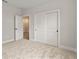 Bright bedroom featuring convenient closet with sliding doors and a calming neutral palette at 3022 Peel Ave, Orlando, FL 32806