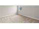 Inviting bedroom with neutral walls, carpet flooring, and a sunlit window at 3022 Peel Ave, Orlando, FL 32806
