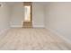 Neutral bonus room with carpet and a few steps up to an open door way to another room at 3022 Peel Ave, Orlando, FL 32806