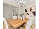 Dining room featuring a modern chandelier, stylish artwork, and access to other rooms in the home at 3022 Peel Ave, Orlando, FL 32806