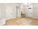 Spacious foyer featuring hardwood floors, a table, a rug, and multiple entryways to other rooms at 3022 Peel Ave, Orlando, FL 32806