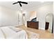 Bright main bedroom showcases neutral decor, a dresser, a full-length mirror, and natural light at 3022 Peel Ave, Orlando, FL 32806