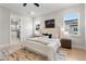 Comfortable main bedroom provides natural light, a plush bed, and an ensuite bathroom at 3022 Peel Ave, Orlando, FL 32806