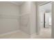 Walk-in closet with an open wire shelving system provides an organized storage solution at 3022 Peel Ave, Orlando, FL 32806