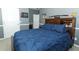 Bedroom features include comfy bed with storage, desk, and cool sporty wall art at 319 Morning View Dr, Winter Garden, FL 34787