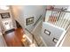 Aerial view of the inviting entryway shows staircase, hardwood floors, and arched doorways at 319 Morning View Dr, Winter Garden, FL 34787
