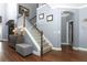 Inviting entryway boasts hardwood floors, staircase, and arched doorways, creating a welcoming atmosphere at 319 Morning View Dr, Winter Garden, FL 34787