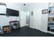 Home gym featuring workout equipment and storage at 319 Morning View Dr, Winter Garden, FL 34787