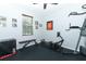 Home gym with exercise equipment, natural light, and personalized decor at 319 Morning View Dr, Winter Garden, FL 34787
