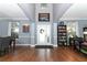 Spacious foyer with high ceilings, hardwood floors, and a decorative front door at 319 Morning View Dr, Winter Garden, FL 34787