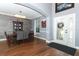 Open foyer showcases the front door, a view to the dining room, and wood floors at 319 Morning View Dr, Winter Garden, FL 34787