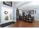 Bright foyer with a glass front door, an adjacent office space, and hardwood floors at 319 Morning View Dr, Winter Garden, FL 34787