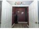 Hallway to bonus room has wood-look floors, and is painted in dark colors at 319 Morning View Dr, Winter Garden, FL 34787