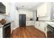 Updated kitchen featuring white cabinetry, stainless steel appliances, and a stylish design at 319 Morning View Dr, Winter Garden, FL 34787