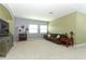 Spacious living room with neutral carpet, console, sofa and natural light at 319 Morning View Dr, Winter Garden, FL 34787