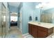 Spacious main bathroom featuring double sinks, a walk-in shower, and tile flooring at 319 Morning View Dr, Winter Garden, FL 34787