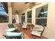 Covered patio features a ceiling fan and patio furniture, great for entertaining guests at 319 Morning View Dr, Winter Garden, FL 34787