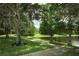Scenic sidewalk winds past a serene pond and lush landscape, perfect for a stroll at 319 Morning View Dr, Winter Garden, FL 34787