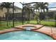 Private pool and spa features fountains and a screened enclosure and manicured landscaping at 319 Morning View Dr, Winter Garden, FL 34787