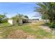 Backyard featuring a covered patio perfect for outdoor relaxation and a spacious fenced yard at 3342 Sanborn Ln, Deltona, FL 32738