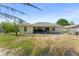 Backyard featuring a patio area perfect for outdoor relaxation and a well maintained yard at 3342 Sanborn Ln, Deltona, FL 32738